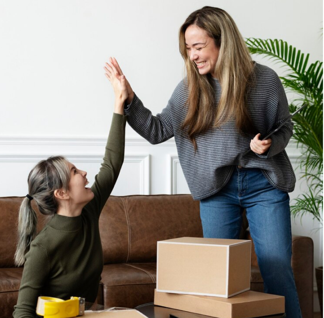 Excited mom and daughter celebrating their move with top-notch moving and storage services in West Palm Beach, FL by Sergeant Moving and Storage